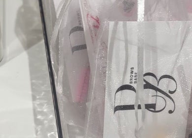 Beauty materials with BROWS BABE logo in Melbourne, Victoria, AU, showcasing elegant branding.
