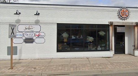 Street view of The Sugar Lounge exterior in St. Thomas, Ontario, CA, showcasing a modern and inviting facade.