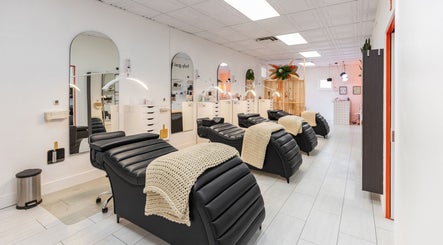 Relaxing interior of San Diego Lashes - Bay Park, showcasing cozy reclining chairs in San Diego, California, US.