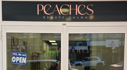 Peaches Beauty Salon entrance in Timaru, Canterbury Region, NZ, with open sign and stylish facade.