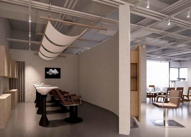 Modern salon interior of LEEKAJA Tangs Plaza in Singapore, showcasing stylish chairs and serene ambiance.