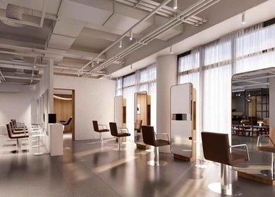 Interior of LEEKAJA Tangs Plaza salon in Singapore, SG featuring modern styling chairs and sleek mirrors.