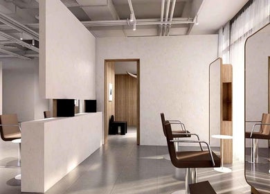 Elegant interior of LEEKAJA Tangs Plaza salon in Singapore, SG, featuring stylish chairs and mirrors.