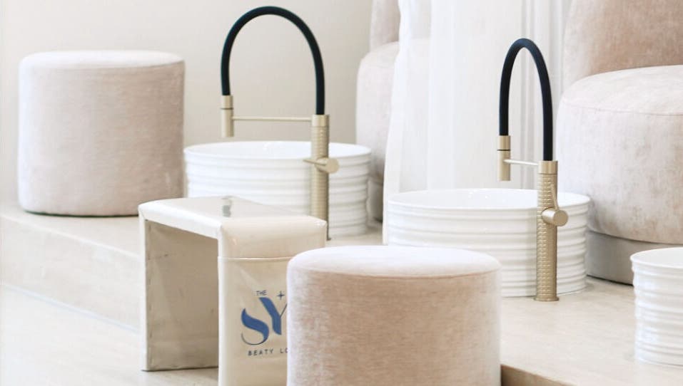 Luxurious pedicure setup at SYS Beauty Lounge in Dubai, Dubai, AE featuring plush seating and stylish faucets.