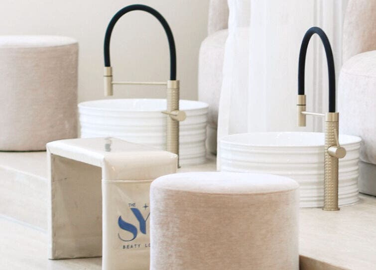 Luxurious pedicure setup at SYS Beauty Lounge in Dubai, Dubai, AE featuring plush seating and stylish faucets.