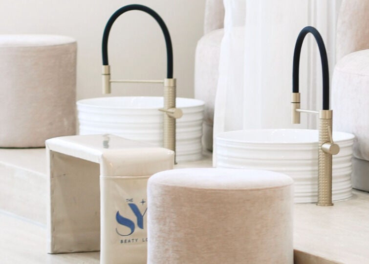 Luxurious pedicure setup at SYS Beauty Lounge in Dubai, Dubai, AE featuring plush seating and stylish faucets.