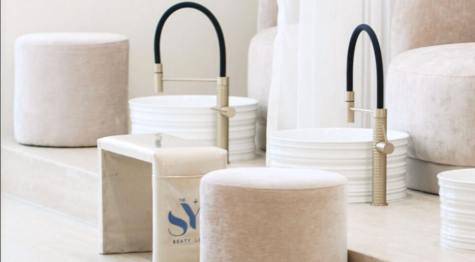 Luxurious pedicure setup at SYS Beauty Lounge in Dubai, Dubai, AE featuring plush seating and stylish faucets.