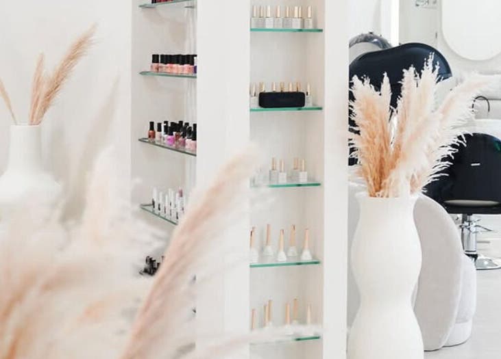 Chic interior of SYS Beauty Lounge in Dubai, Dubai, AE with modern décor and beauty products on display.