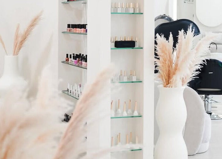 Chic interior of SYS Beauty Lounge in Dubai, Dubai, AE with modern décor and beauty products on display.