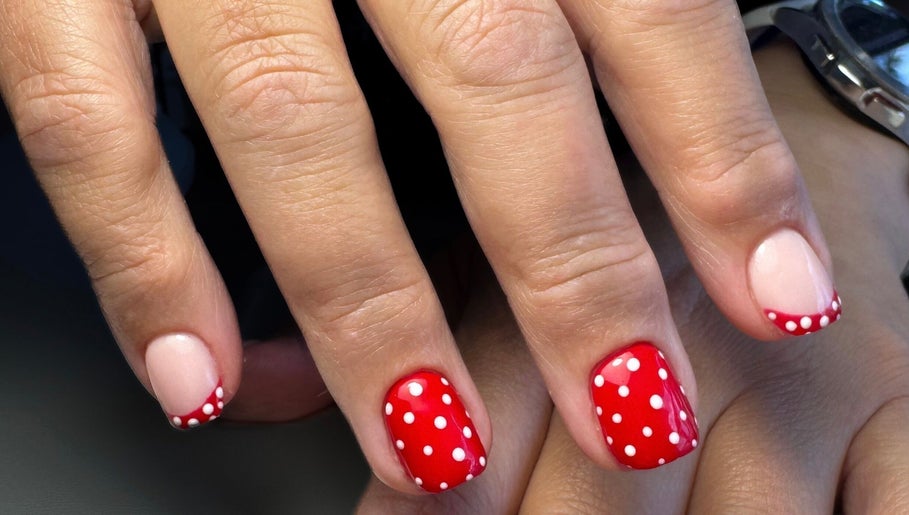 Red polka dot nail art at Thebeautyhut in Haydock, St Helens, England, GB.