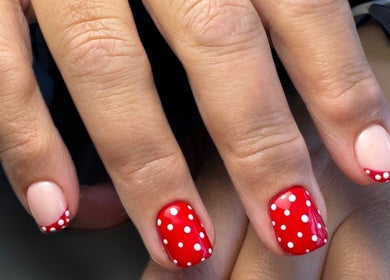 Red polka dot nail art at Thebeautyhut in Haydock, St Helens, England, GB.