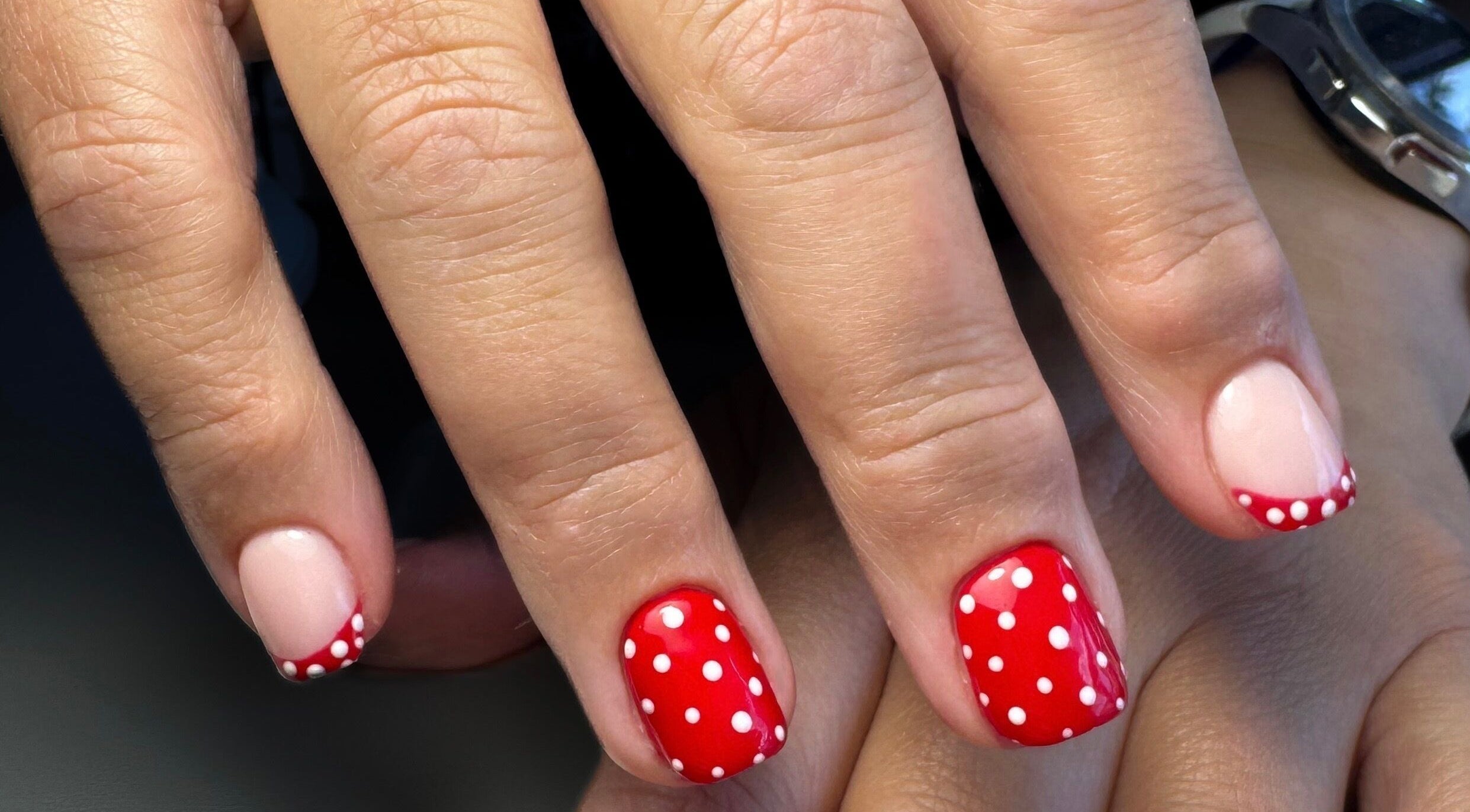 Red polka dot nail art at Thebeautyhut in Haydock, St Helens, England, GB.