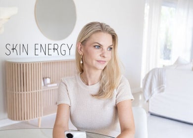 Woman sitting elegantly at Skin Energy, Cape Town, Western Cape, ZA, exuding calm and sophistication.