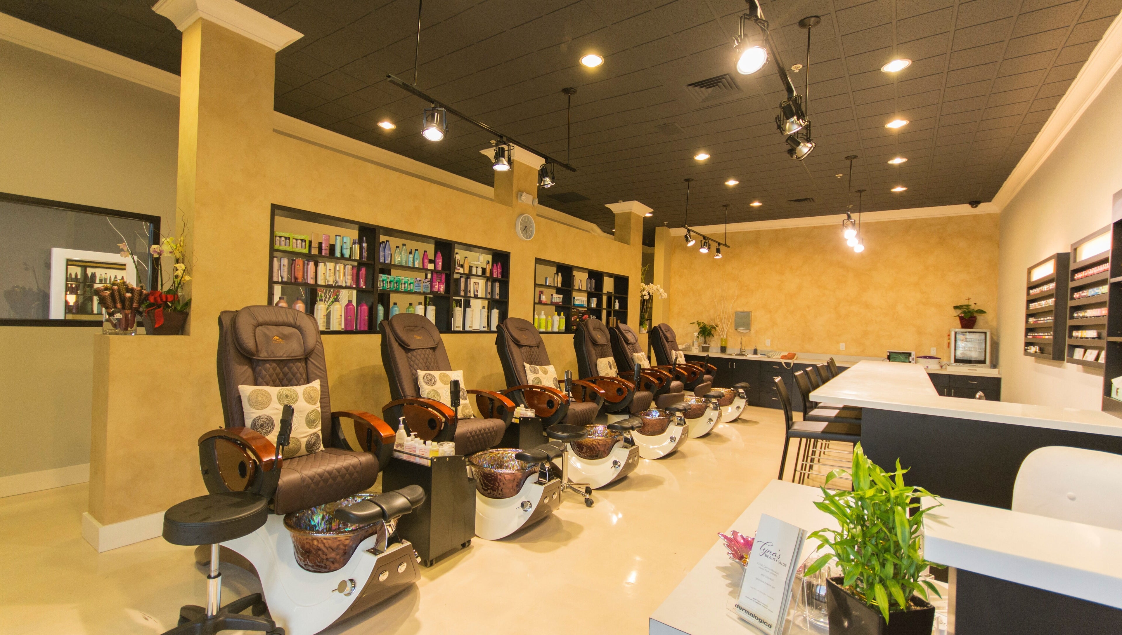 Lyna's Beauty Salon in Menlo Park, California, US features luxurious pedicure chairs and shelves of products.