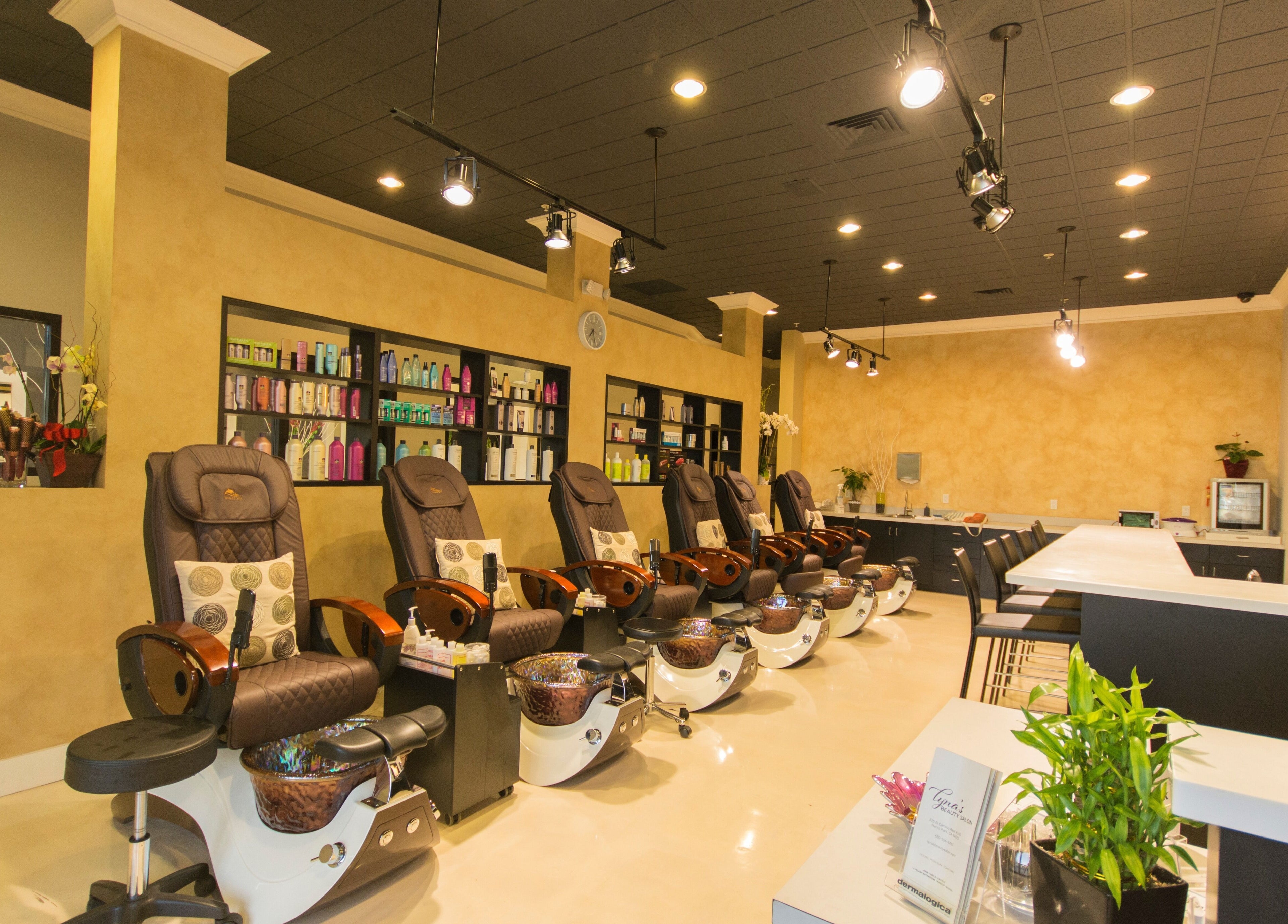 Lyna's Beauty Salon in Menlo Park, California, US features luxurious pedicure chairs and shelves of products.