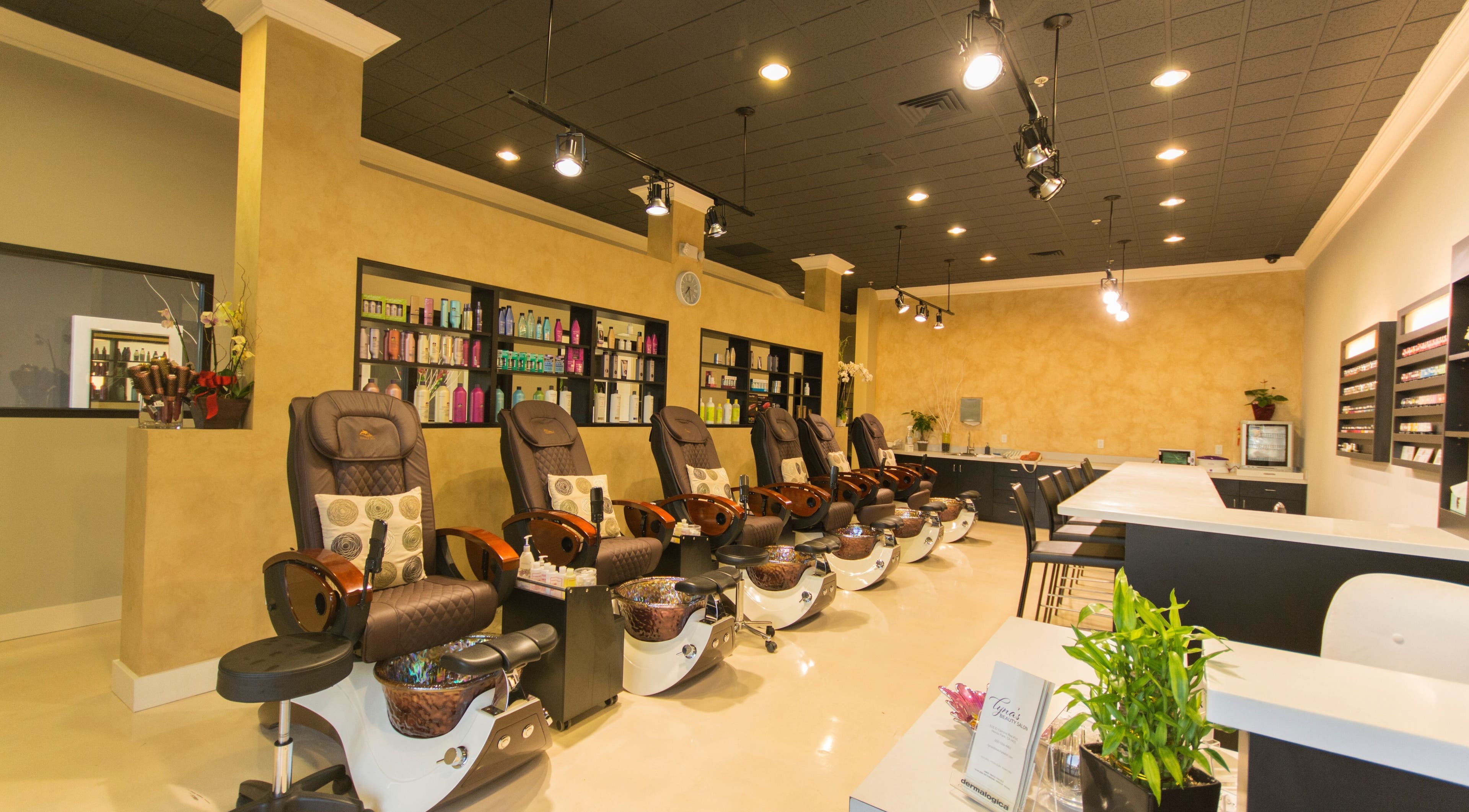 Lyna's Beauty Salon in Menlo Park, California, US features luxurious pedicure chairs and shelves of products.