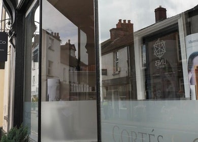 Elegant facade of Cortés & Co Medispa in Usk, Wales, GB, showcasing a stylish exterior with signage.