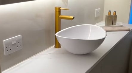 Modern sink with gold faucet at Cortés & Co Medispa, Usk, Wales, GB