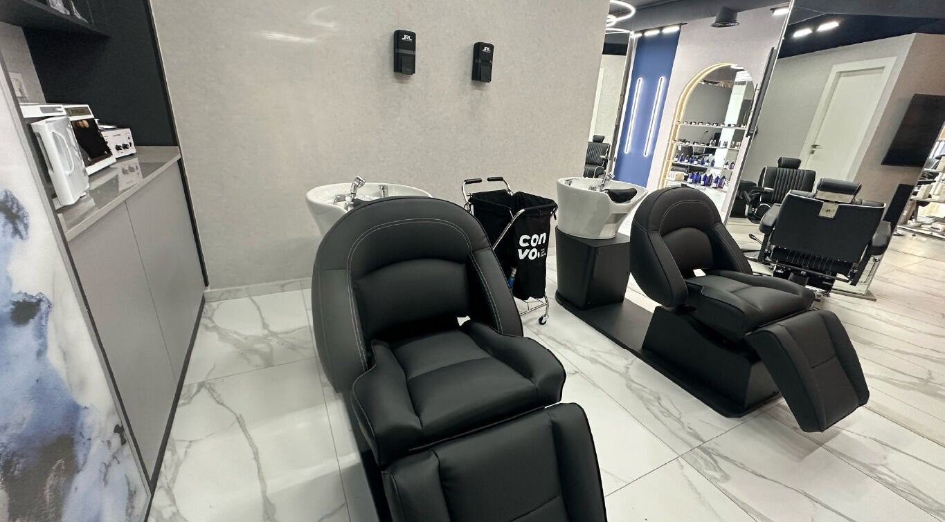 Luxurious wash area with black reclining chairs at Convo, Amman, Amman Governorate, JO.