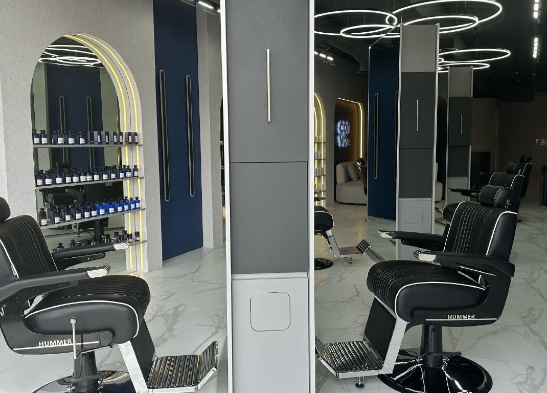 Modern salon interior at Convo, Amman, Amman Governorate, JO featuring stylish chairs and sleek design elements.