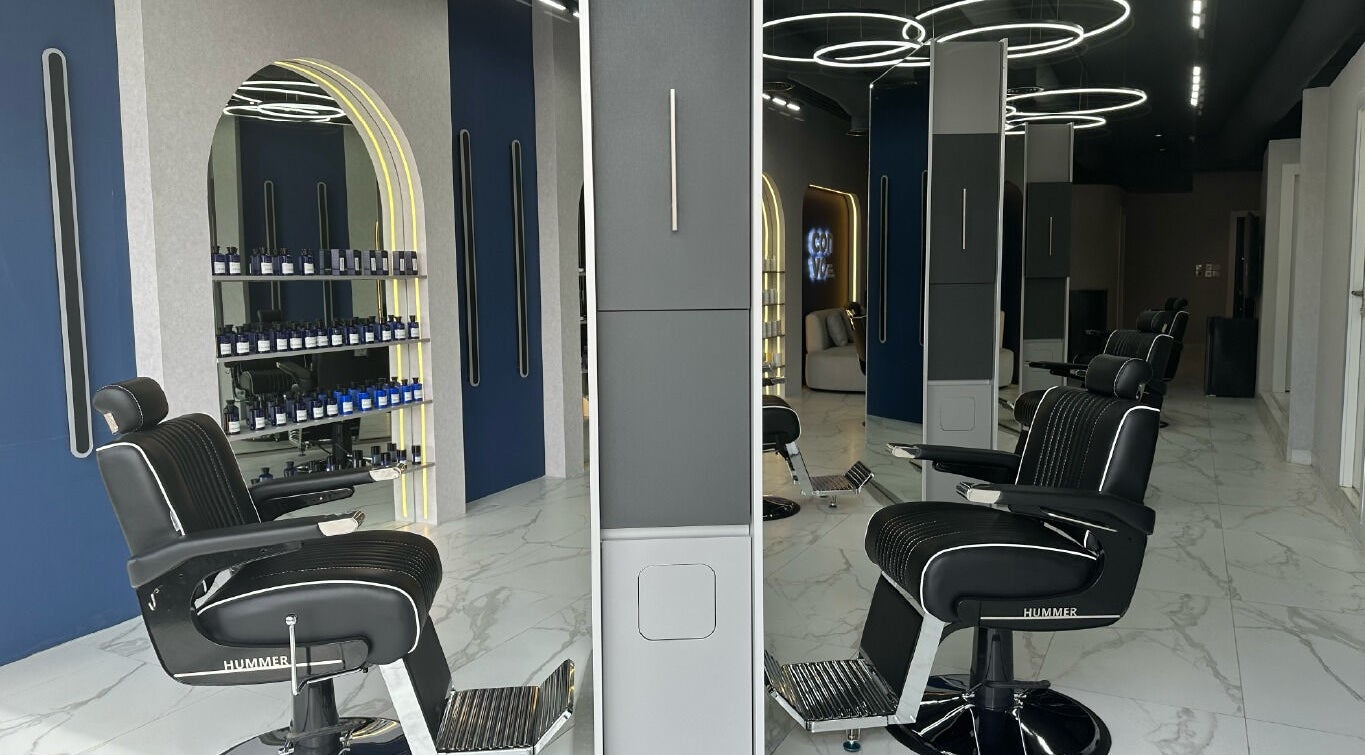 Modern salon interior at Convo, Amman, Amman Governorate, JO featuring stylish chairs and sleek design elements.