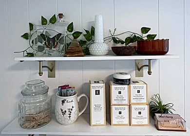 Elegant shelf display at Aesthetics by Juhliah J M in Bend, Oregon, US, featuring beauty products and decor.
