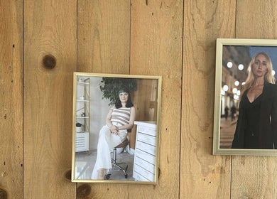 Decorative portraits on wooden wall at Aesthetics by Juhliah J M, Bend, Oregon, US.