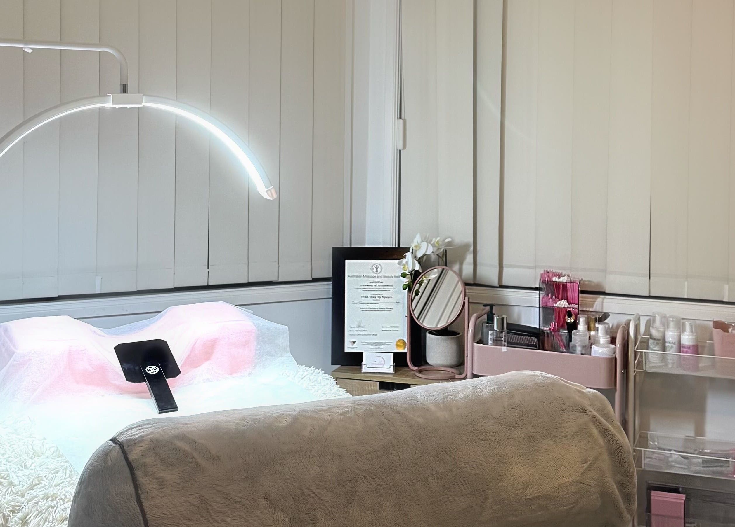 Cozy beauty treatment room at V's Lashes, Hamlyn Terrace, New South Wales, AU, with serene decor and professional setup.