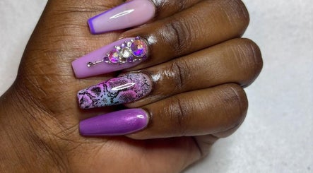 Stylish purple and pink nail art with gems at STUDIO 10, FREEPORT, Grand Bahama, BS.