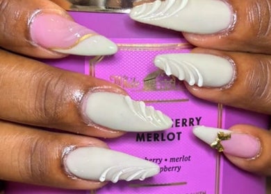 Elegant nail art on display at STUDIO 10, FREEPORT, Grand Bahama, BS. Trendy designs and professional finish.