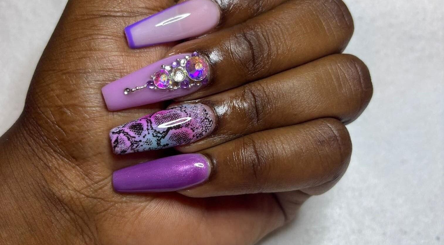 Artful nail design with gems at STUDIO 10, FREEPORT, Grand Bahama, BS showcasing creativity and style.