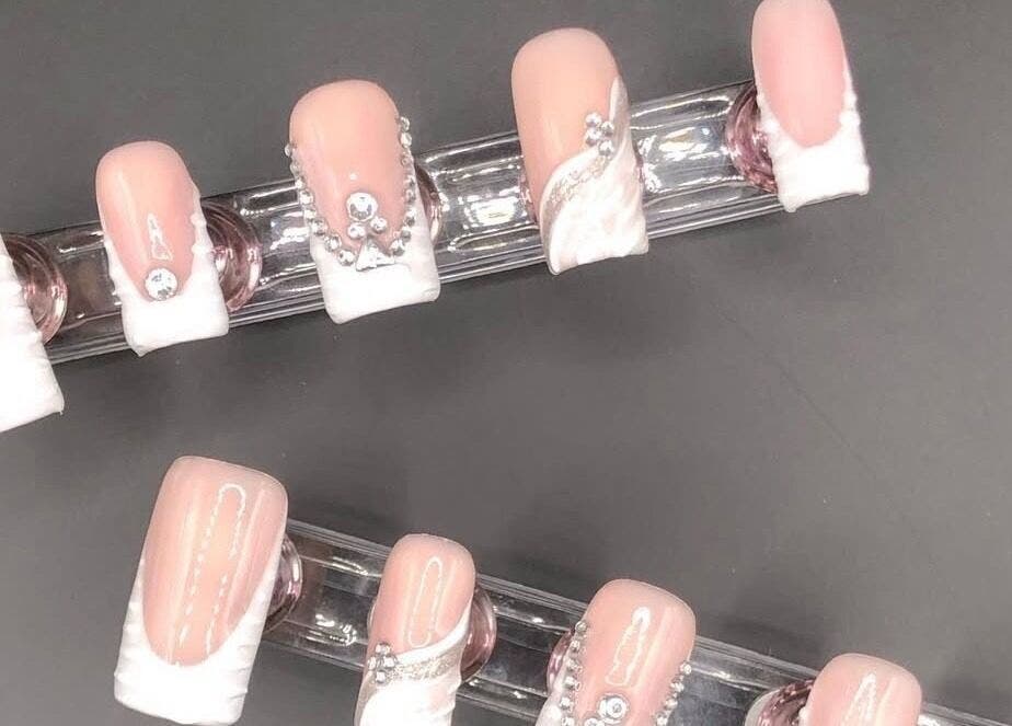 Elegant nail designs with rhinestones at STUDIO 10, FREEPORT, Grand Bahama, BS. Perfect for beauty enhancement.