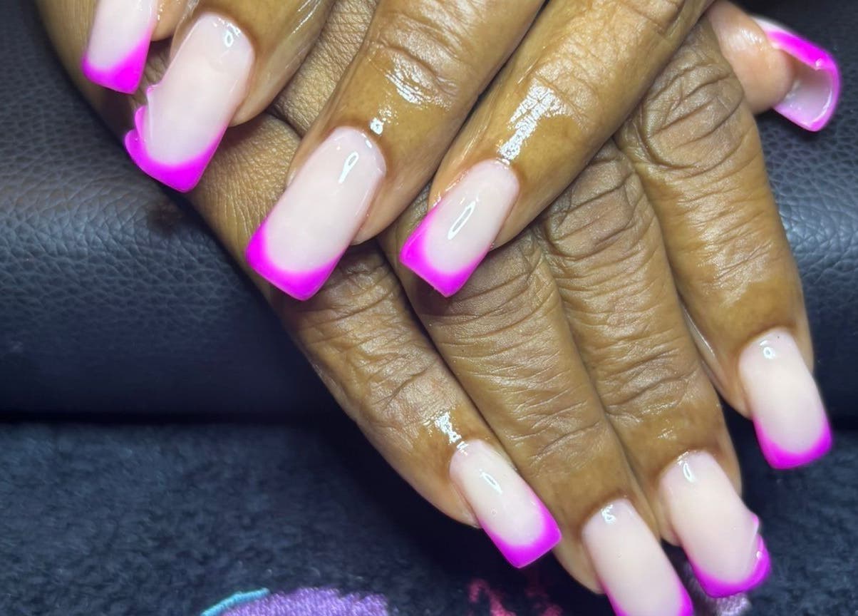 Bright pink and nude nails at STUDIO 10, FREEPORT, Grand Bahama, BS showcasing intricate nail art.