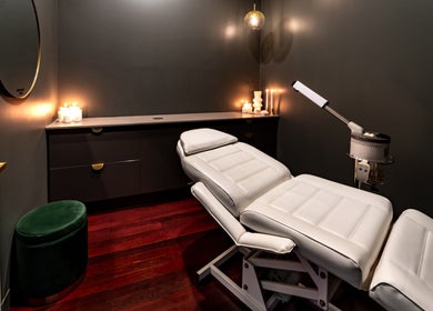 Calm treatment room at Breathe Beauty, Wembley, Western Australia, AU, with soft lighting and comfy chair.