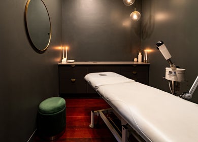 Tranquil treatment room at Breathe Beauty in Wembley, Western Australia, AU with a massage bed and soft lighting.