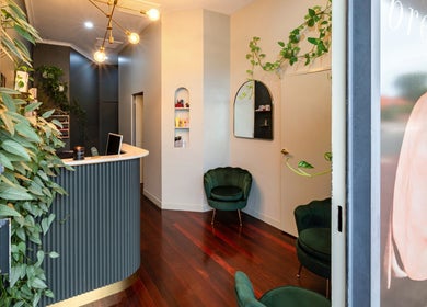 Elegant reception at Breathe Beauty in Wembley, Western Australia, AU with lush plants and modern decor.
