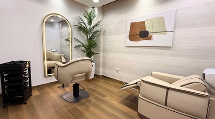 Luxurious interior of Luca Piattelli Hair Fixing Center, Dubai, AE, featuring sleek chairs and elegant decor.
