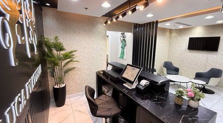 Reception area of Luca Piattelli Hair Fixing Center, Dubai, Dubai, AE with modern seating and sleek decor.