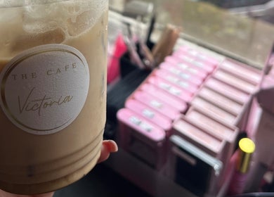 A relaxing setup at Cherry Lashes|Brows by Anna Dunlop in Ayr, Scotland, GB with cosmetics and iced coffee.