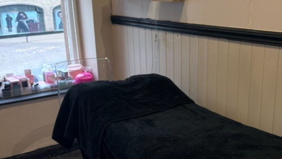 Cozy treatment room at Cherry Lashes|Brows by Anna Dunlop, Ayr, Scotland, GB with a comfortable black bed.