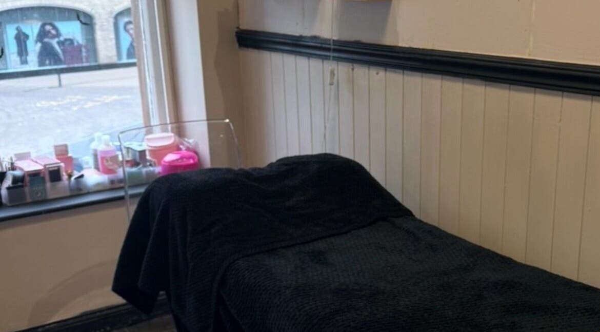 Cozy treatment room at Cherry Lashes|Brows by Anna Dunlop, Ayr, Scotland, GB with a comfortable black bed.