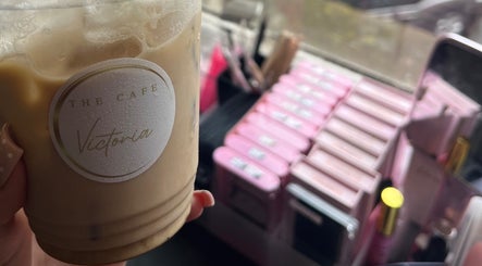 Cozy coffee moment at Cherry Lashes|Brows by Anna Dunlop in Ayr, Scotland, GB with beauty products in the background.