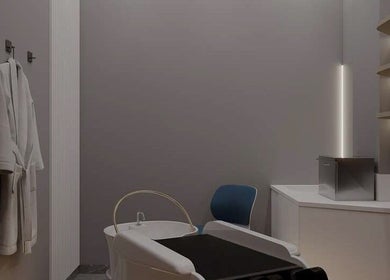 Elegant spa room at Lifting Pro Face and Body Treatments Spa in Dubai, Dubai, AE with cozy chair and robe.