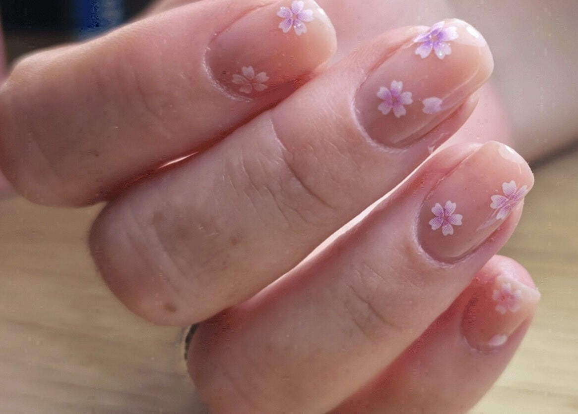 Delicate floral nail art at LM Elixirs & Nails, Newhaven, England, GB, showcasing exquisite craftsmanship.