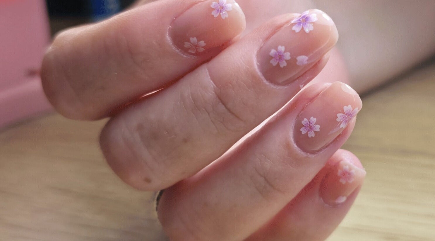 Delicate floral nail art at LM Elixirs & Nails, Newhaven, England, GB, showcasing exquisite craftsmanship.