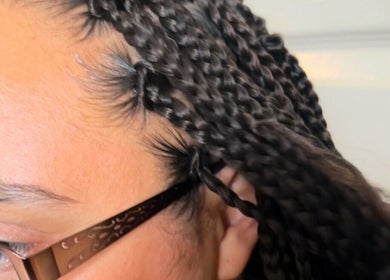 Close-up of intricate braids at BraidsbyAnesu in Huddersfield, England, GB.