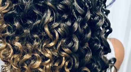 Close-up of intricate braids and curls at BraidsbyAnesu, Huddersfield, England, GB.