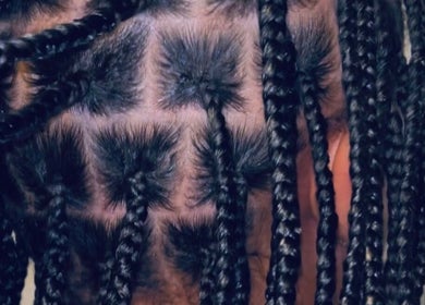 Stylish braids detail at BraidsbyAnesu, Huddersfield, England, GB showcasing tight, neat craftsmanship.