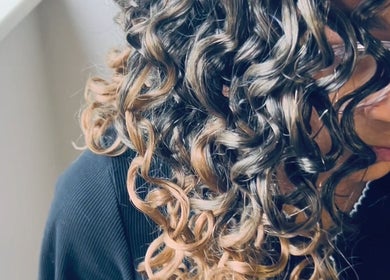 Close-up of curled hairstyle at BraidsbyAnesu in Huddersfield, England, GB, highlighting detailed work.