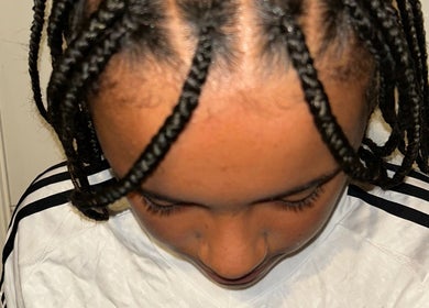Close-up of neat braids at BraidsbyAnesu, located in Huddersfield, England, GB.
